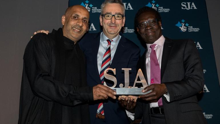 Salaam Peace receive the 2019 Sport for Change Award from Sport England CEO Tim Hollingsworth